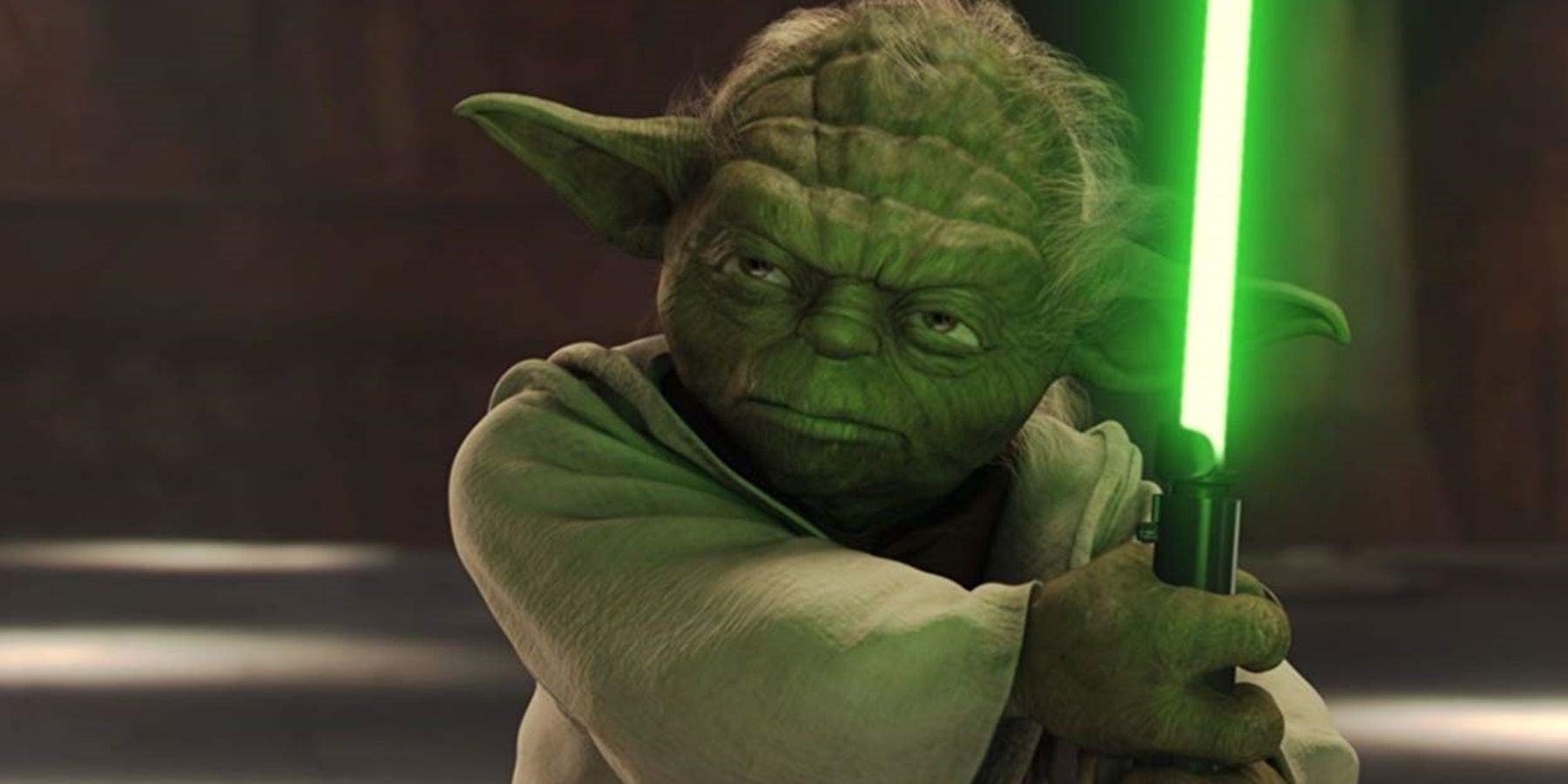 Yoda maniant le sabre-laser.