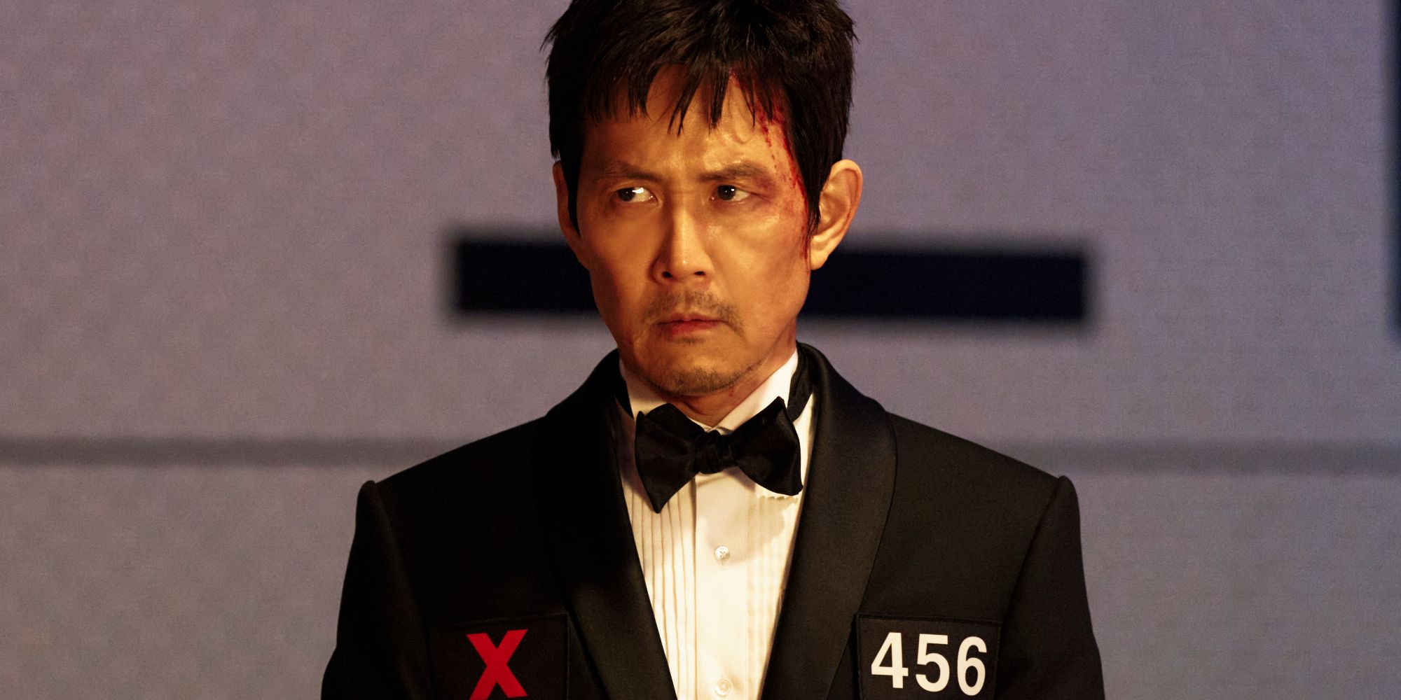 Gi-hun porte un costume dans la saison 3 de Squid Game.