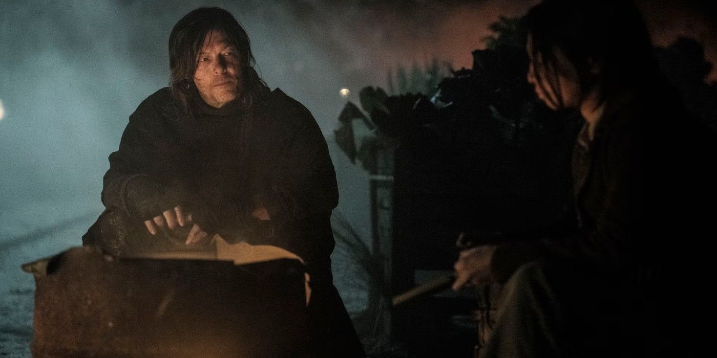 Daryl (Norman Reedus) est assis avec Paz (Alexandra Masangka) près d'un feu dans The Walking Dead: Daryl Dixon.