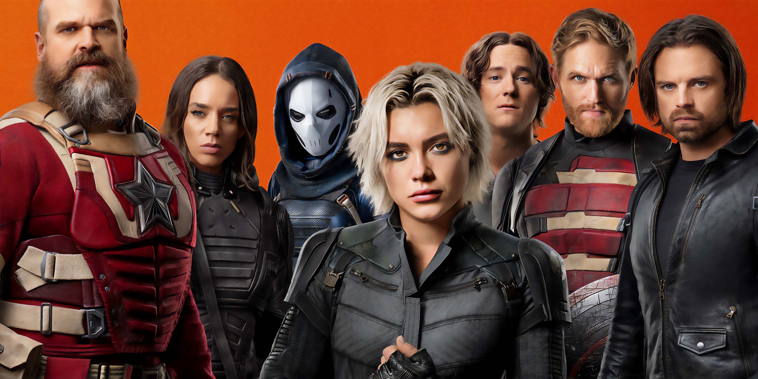 Florence Pugh et l'équipe des Thunderbolts* au complet posant devant un fond orange.