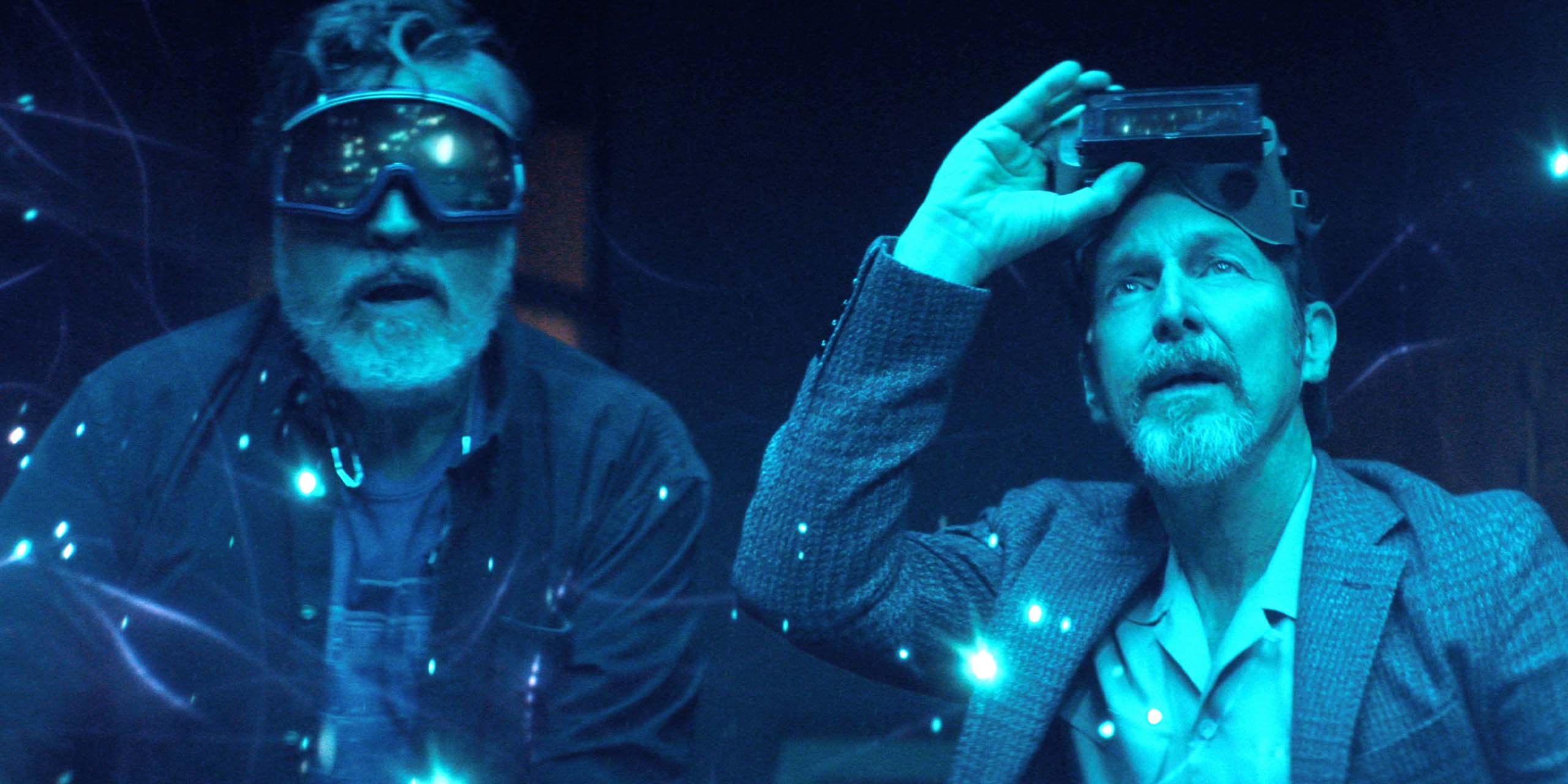 Sam et Wally observent des particules bleues dans The Boroughs : Retraite rebelle sur Netflix.