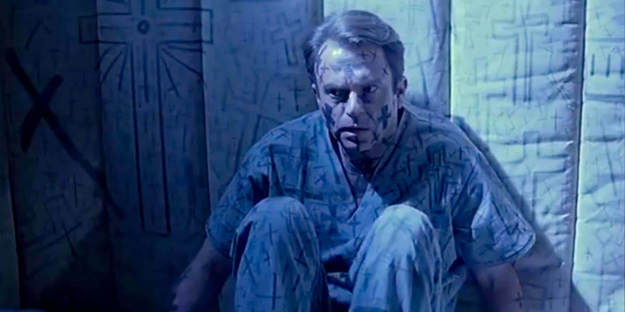 Sam Neill dans le film L'Antre de la Folie de John Carpenter.