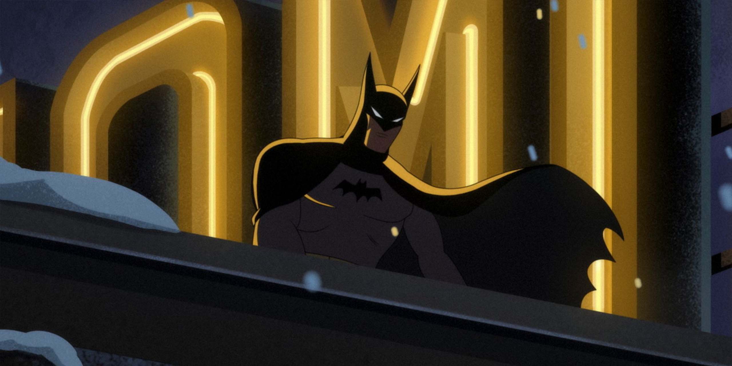 Batman sur le toit d'un immeuble de Gotham dans Batman: Caped Crusader.